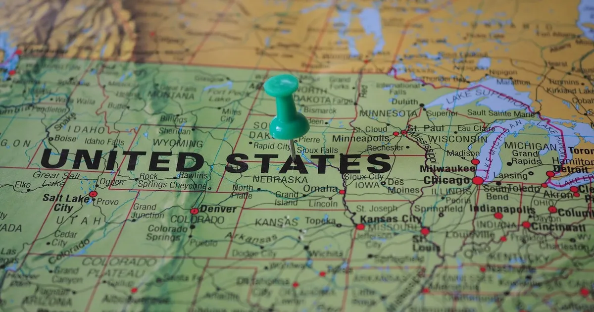 A push pin marking a location on a map of the United States